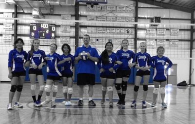 Coach Jason Wells and the MS volleyball team.
